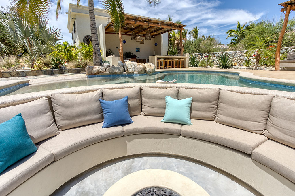 Fire pit and lounge area by the pool
